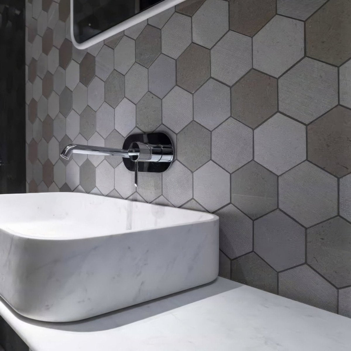 World Hexagon Texture Grey Mosaic grey hexagonal textured mosaic with a white marble vessel sink