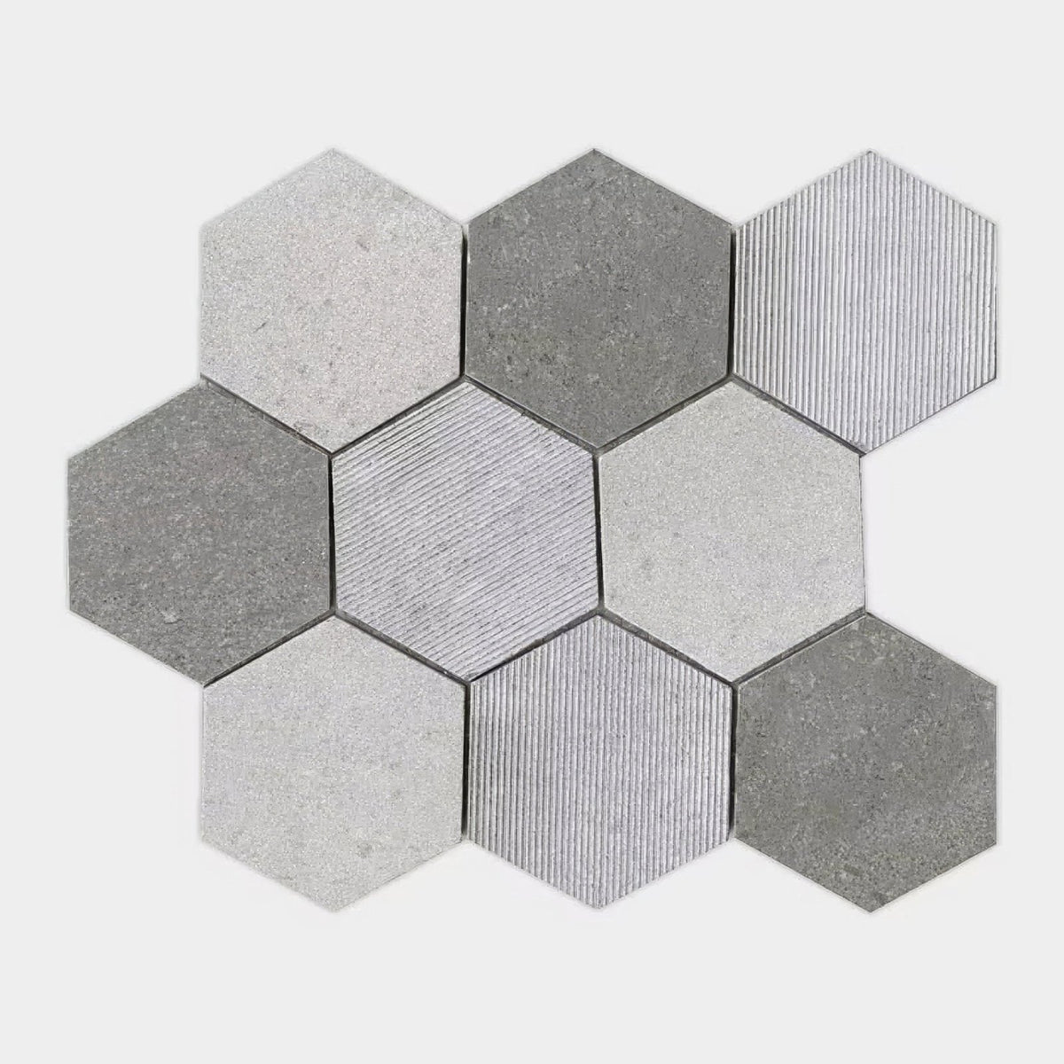 World hexagon texture grey mosaic hexagonal tile set in varying shades of gray with textured and grooved surfaces