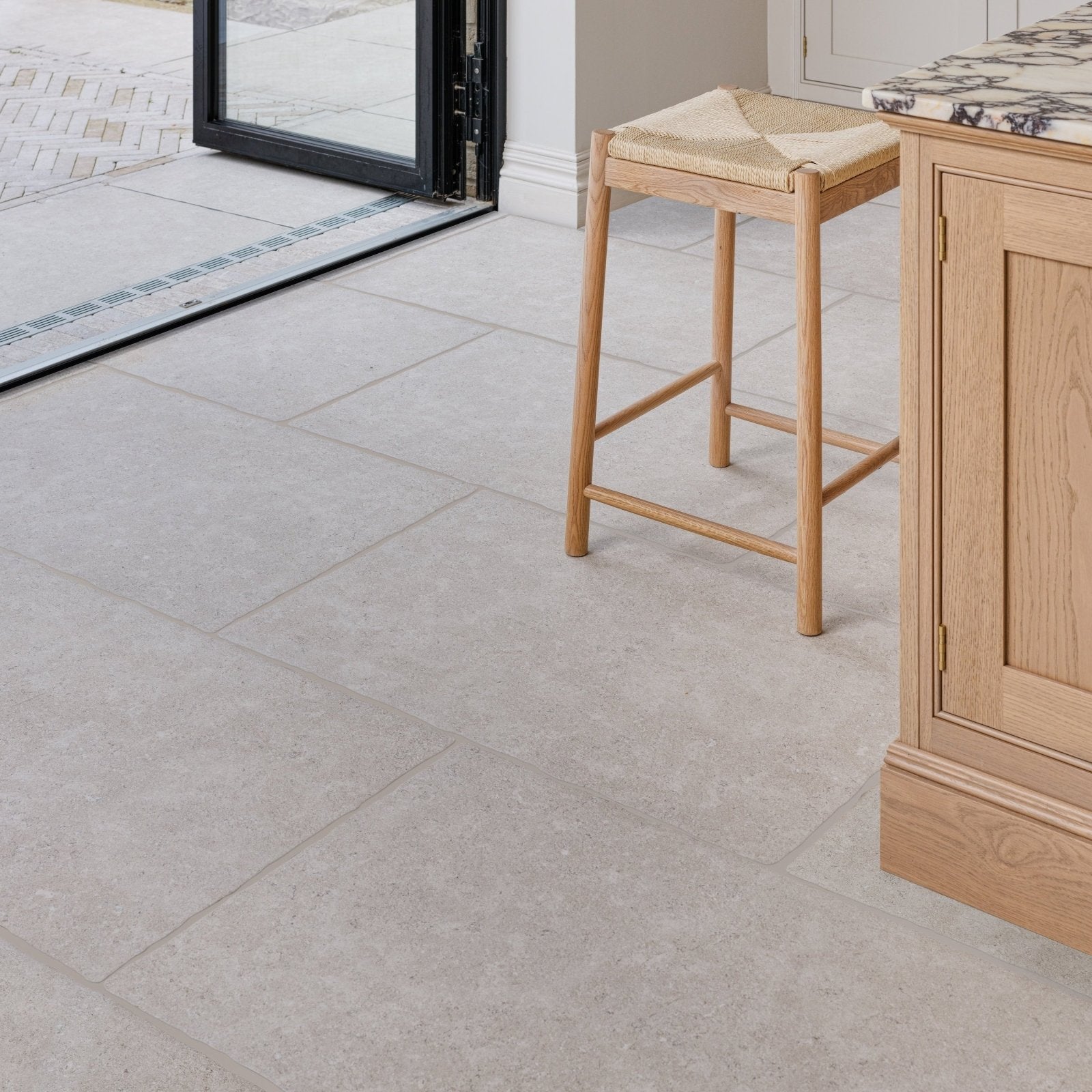 Light gray wychwood claire porcelain matt stone tile with subtle speckles and matte finish 60 by 90 cm
