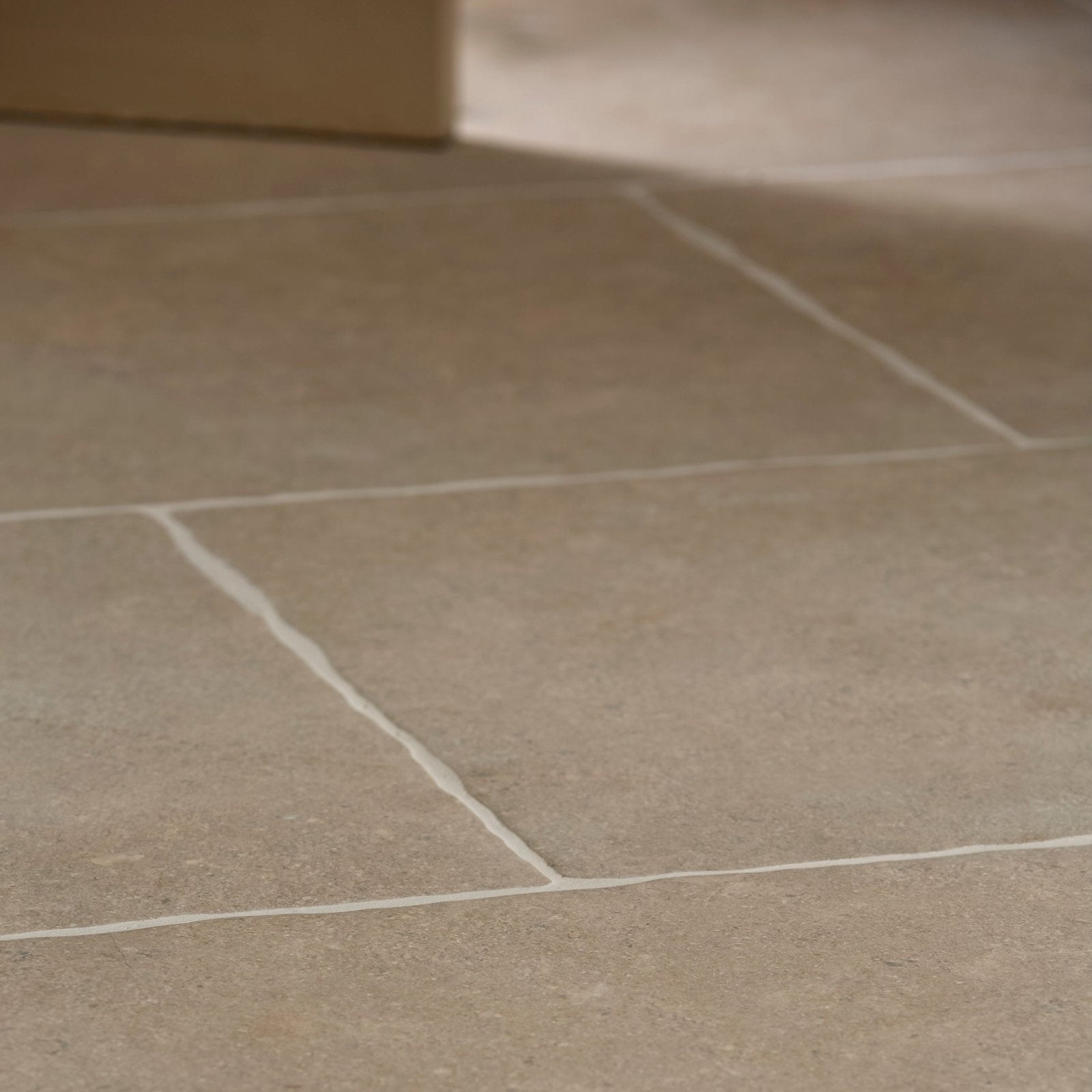 Beige wychwood porcelain matt stone tiles 60 x 90cm with subtle natural texture and crisp white grout lines