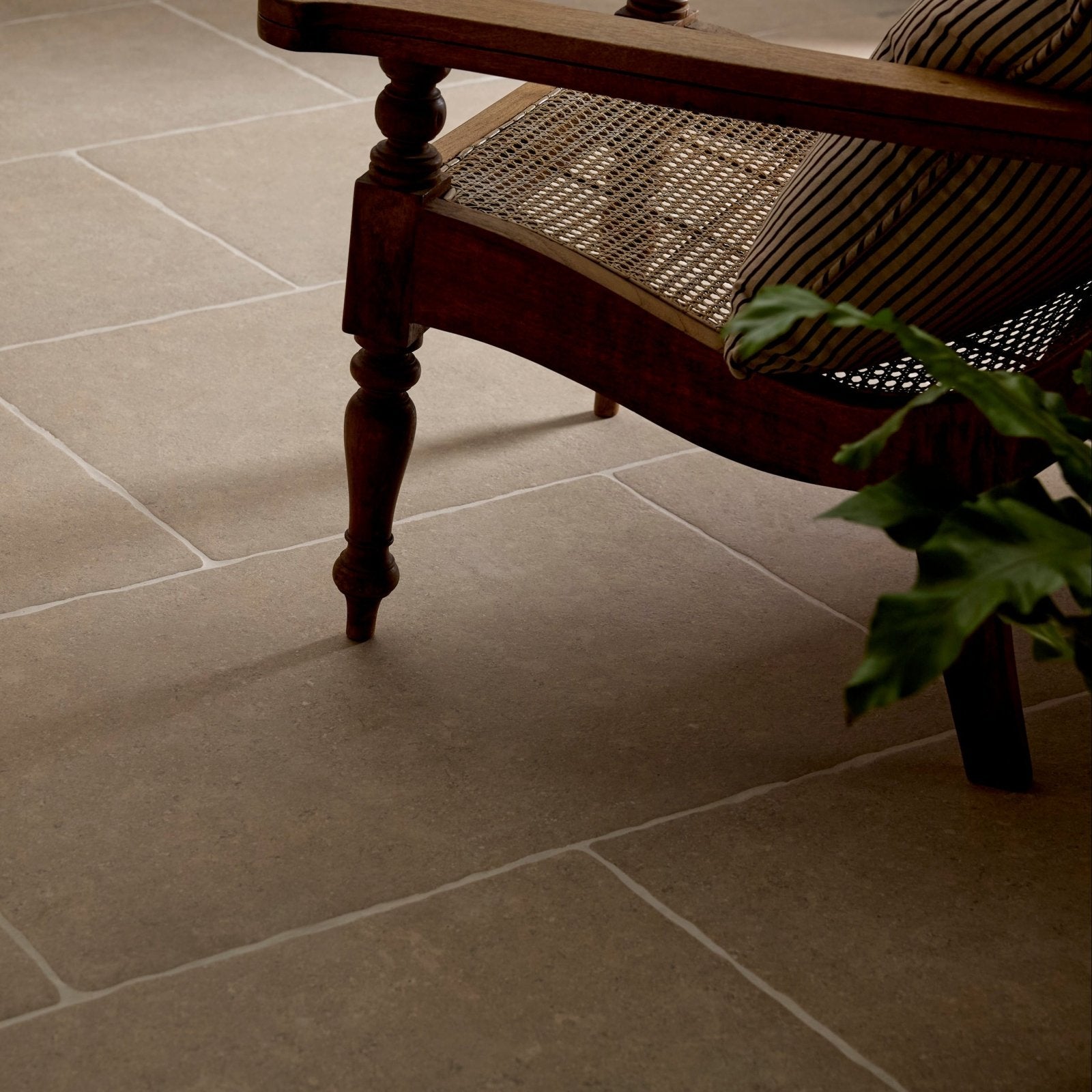 Close-up of wychwood porcelain matt 60 x 90cm large rectangular stone tiles in muted grayish-brown with natural tone variations