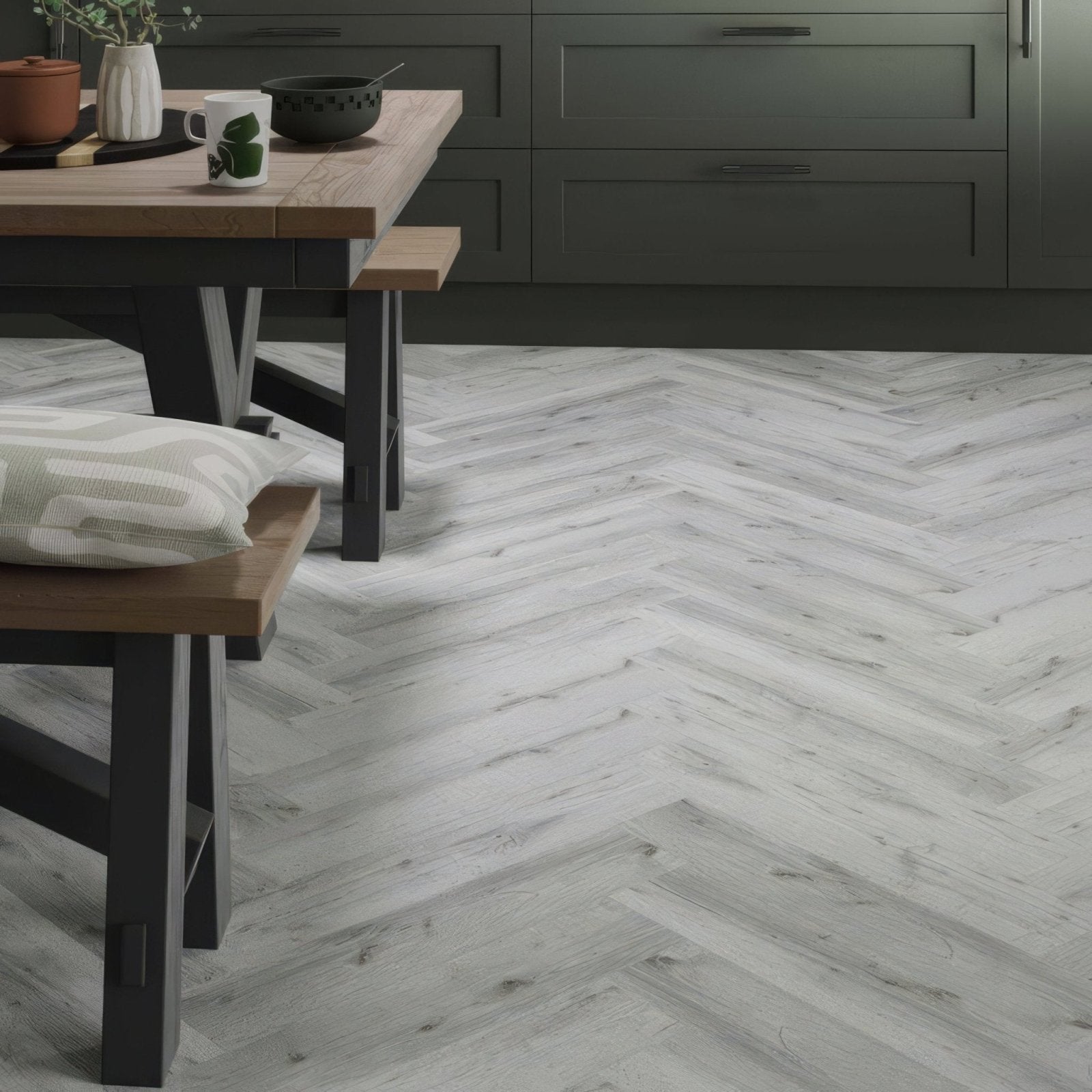 Wyre silver oak herringbone light gray vinyl flooring with subtle wood grain texture and a herringbone pattern