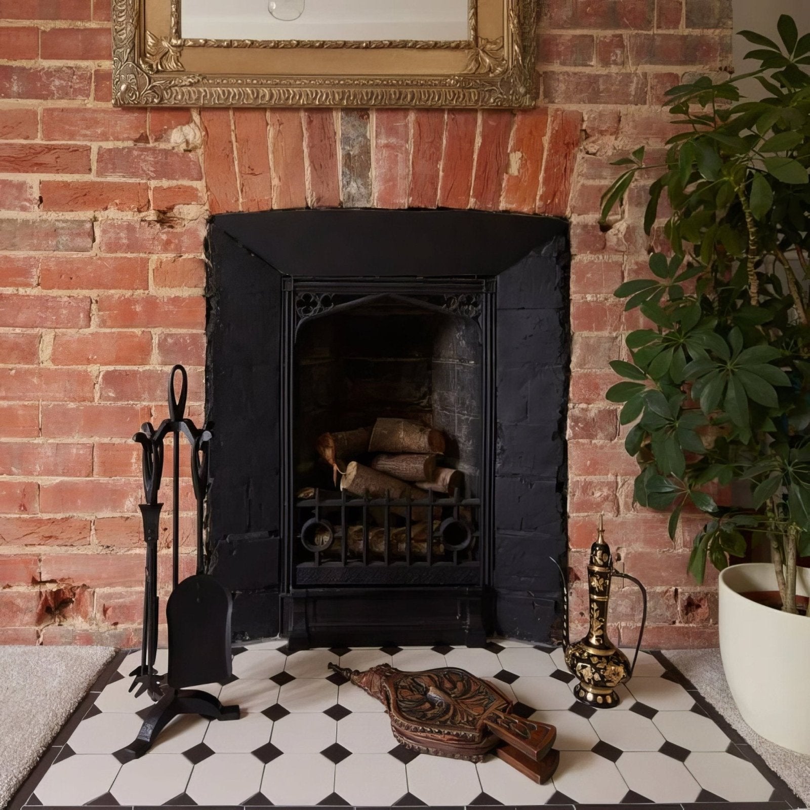Black wrought iron york fireplace with ornate detailing and stacked logs inside for stylish heating use