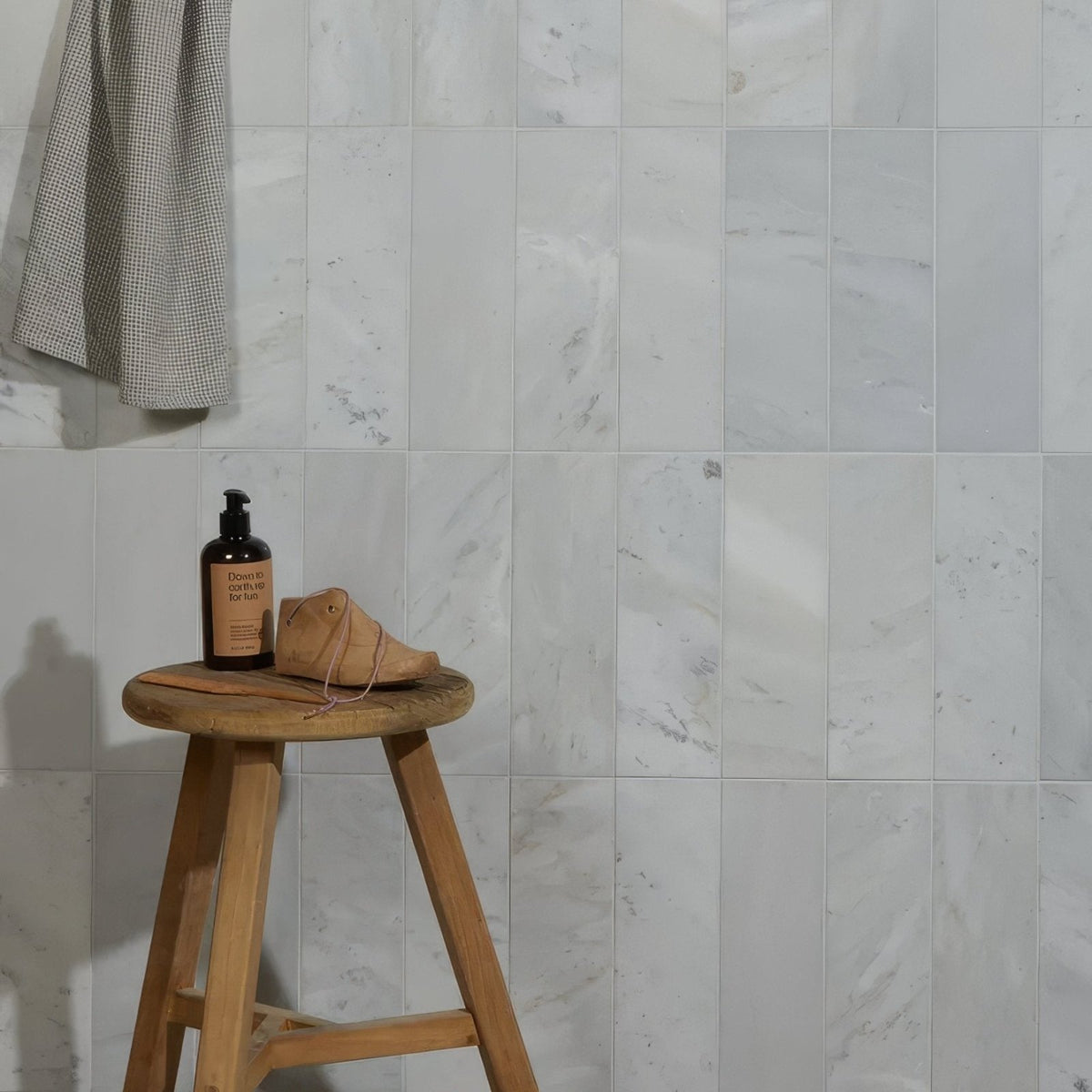 Zen Marble Honed Finish Brick white marble brick tiles with a leather shoe
