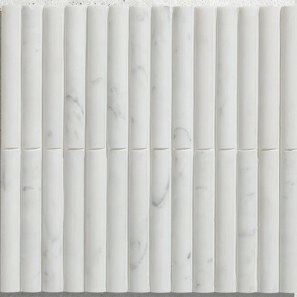 Zen marble reed mosaic white marble tile with vertical cylindrical segments and subtle gray veining texture