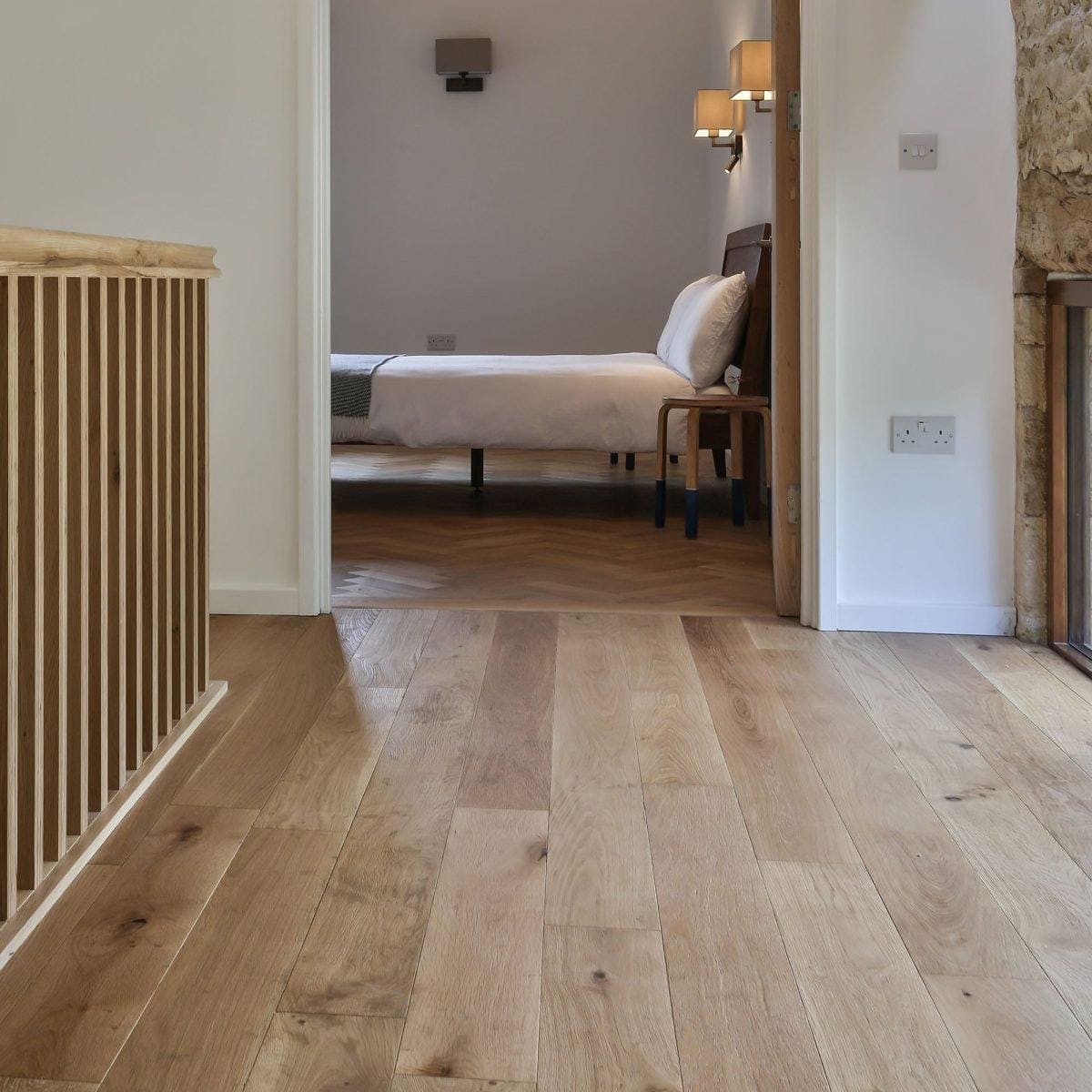 Light-colored hardwood floor with natural grain and subtle knots alpine oak rustic brushed and oiled finish