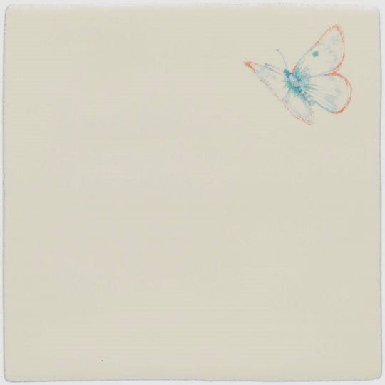 A delicate watercolor blue and pink butterfly illustration on a pale cream ceramic tile titled amethyst aurora pastel on palomino