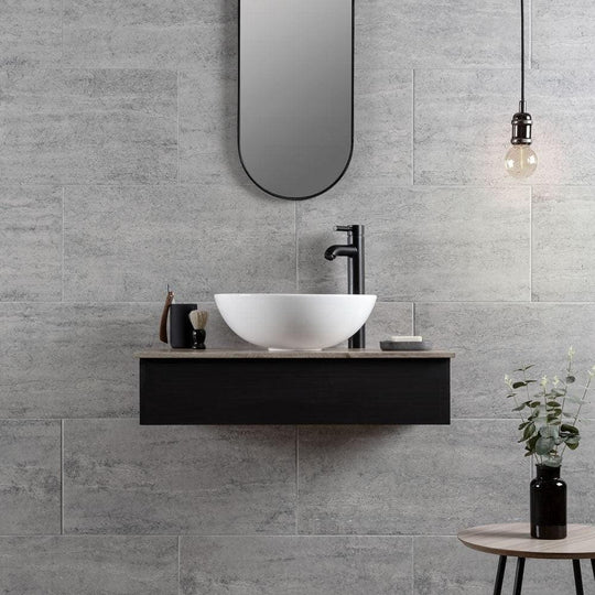 Atrium Marte Grafito Tiles grey concrete-effect tiles with a white bowl sink on a black vanity