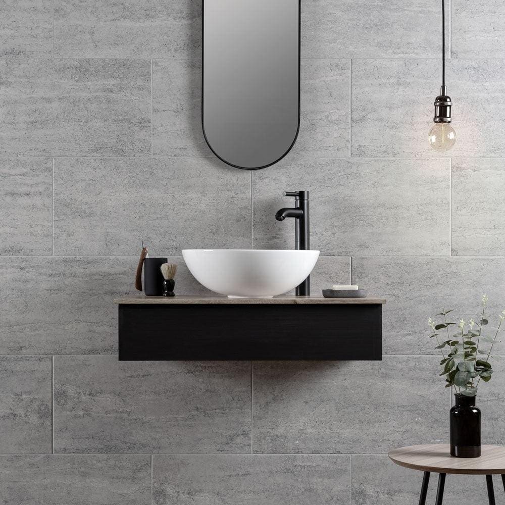 Atrium Marte Grafito Tiles grey concrete-effect tiles with a white bowl sink on a black vanity