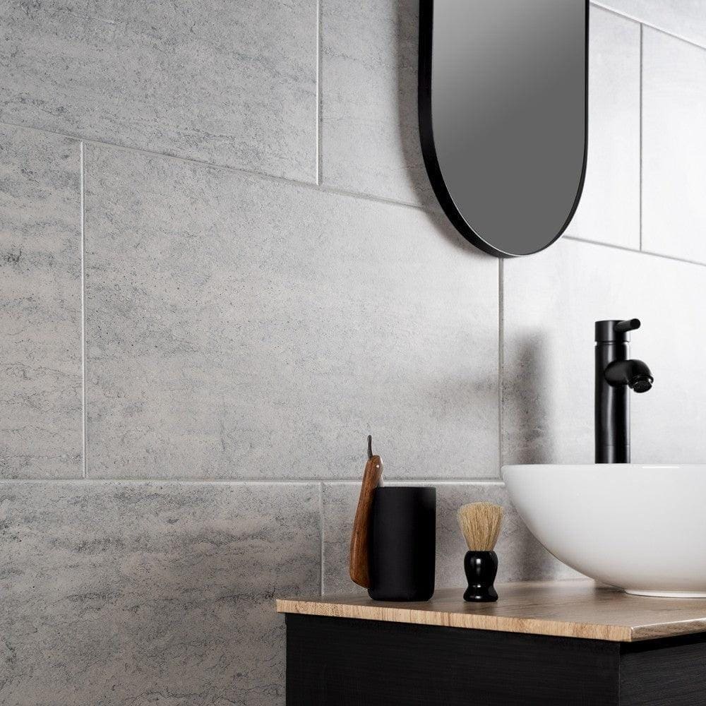 Atrium Marte Grafito Tiles grey concrete-effect tiles with a black shaving brush holder