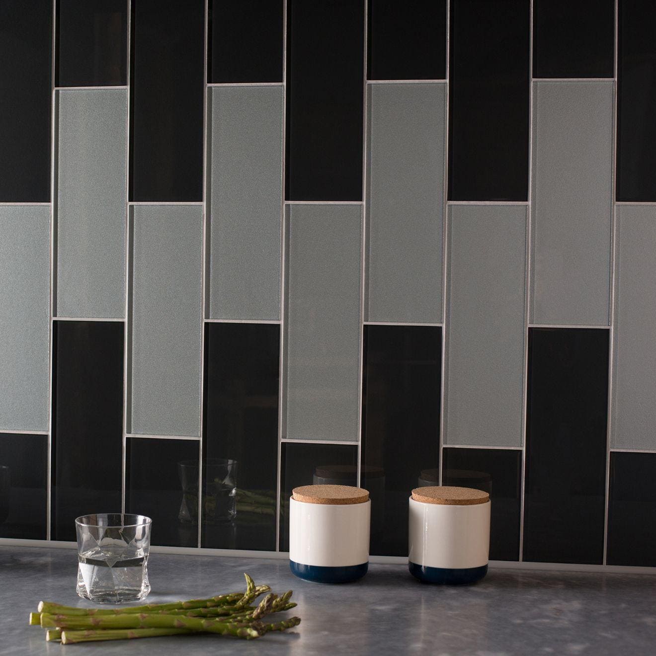 Avon Clear Glass 300 x 100mm grey glass tiles styled with white ceramic kitchen canisters
