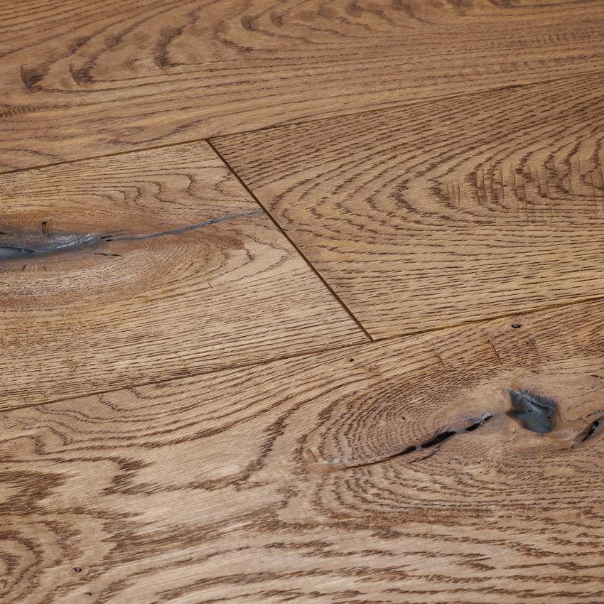Warm-toned berkley cathedral oak hardwood flooring with natural wood grain knots and subtle imperfections