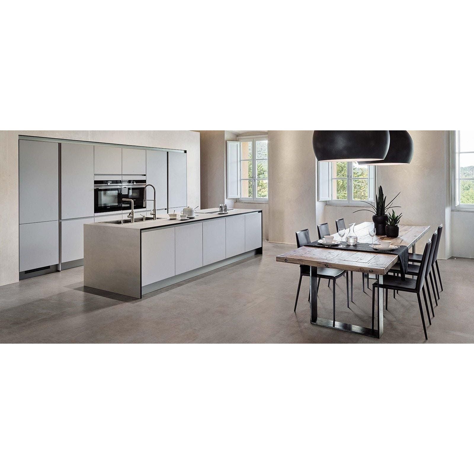 Modern white kitchen island with integrated stainless steel appliances and grey matt Boost 60 x 60cm tiles