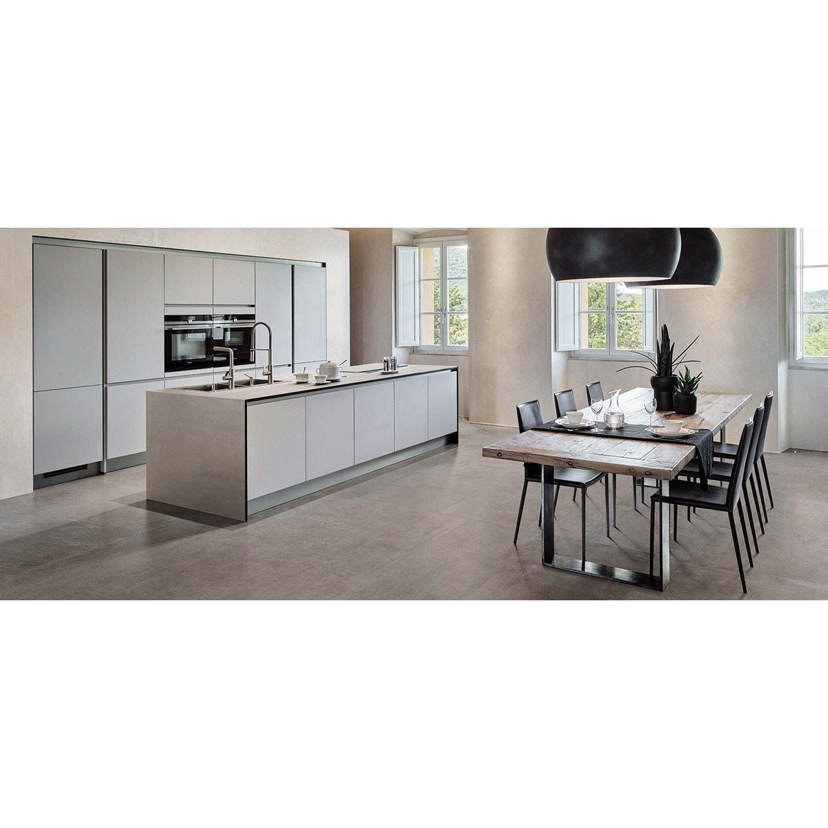 Modern white kitchen island with integrated stainless steel appliances and grey matt Boost 60 x 60cm tiles