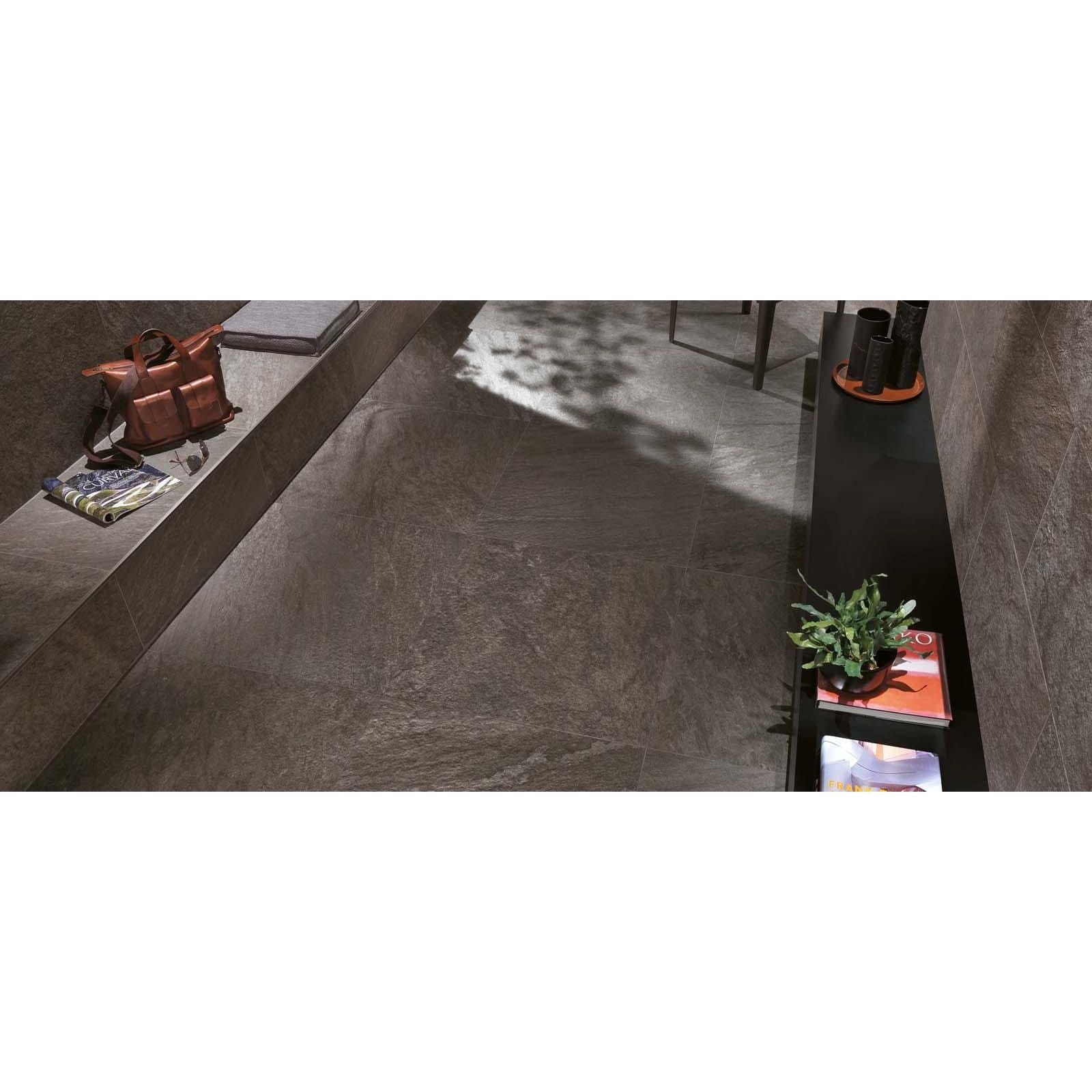 Dark gray stone-look bravestone outdoor earth 20mm floor tiles with subtle natural veining pattern