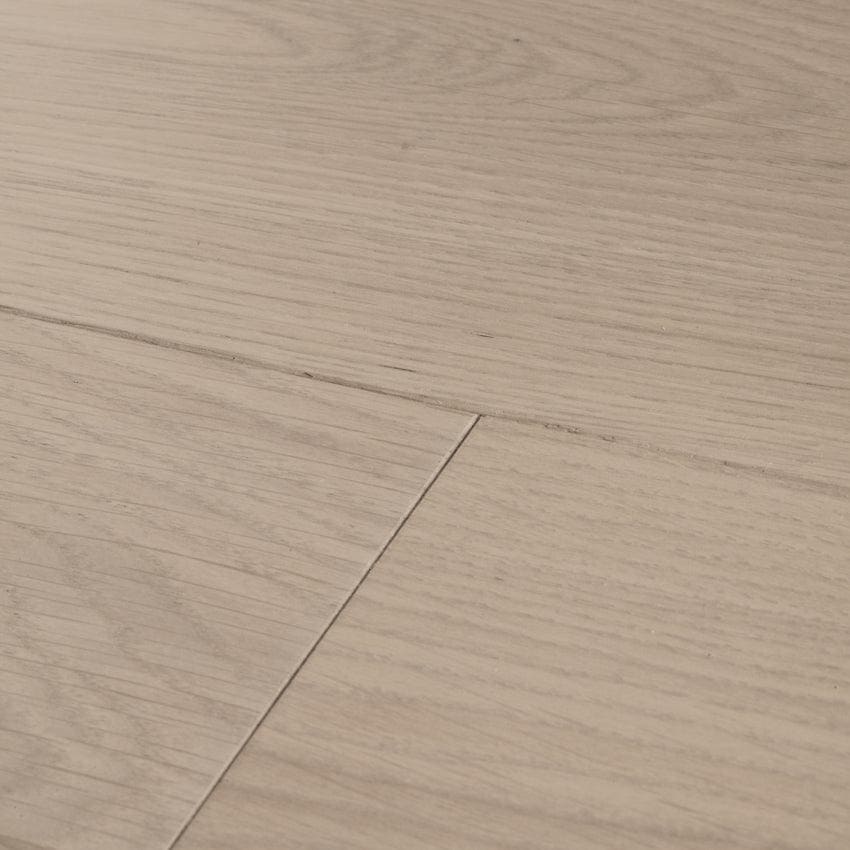 Light beige hardwood floor planks with subtle natural grain in chepstow planed grey oak finish