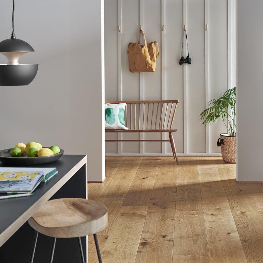 Light-colored oak hardwood floor with natural wood grain and subtle knots in chepstow washed oak finish