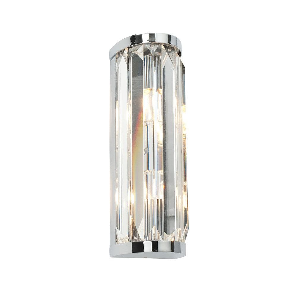 Chrome-finished cylindrical wall sconce with faceted crystal panels for elegant indoor lighting use