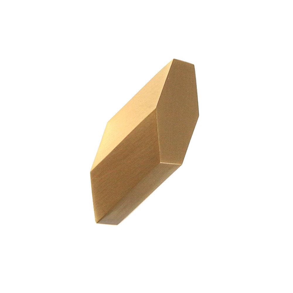 A sleek geometrically faceted brass-colored wall-mounted hook with a modern minimalist design dexter hook brushed brass