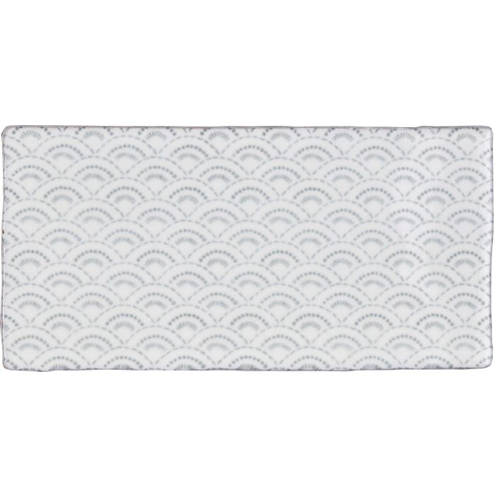White rectangular bath mat from fabrique rosaline french blue with subtle raised gray scalloped wave pattern