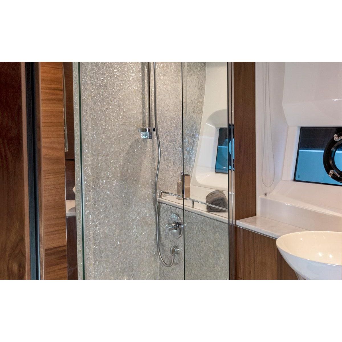 Feature panel crackle shower enclosure with textured frosted glass and chrome fixtures showcasing a shimmering pattern