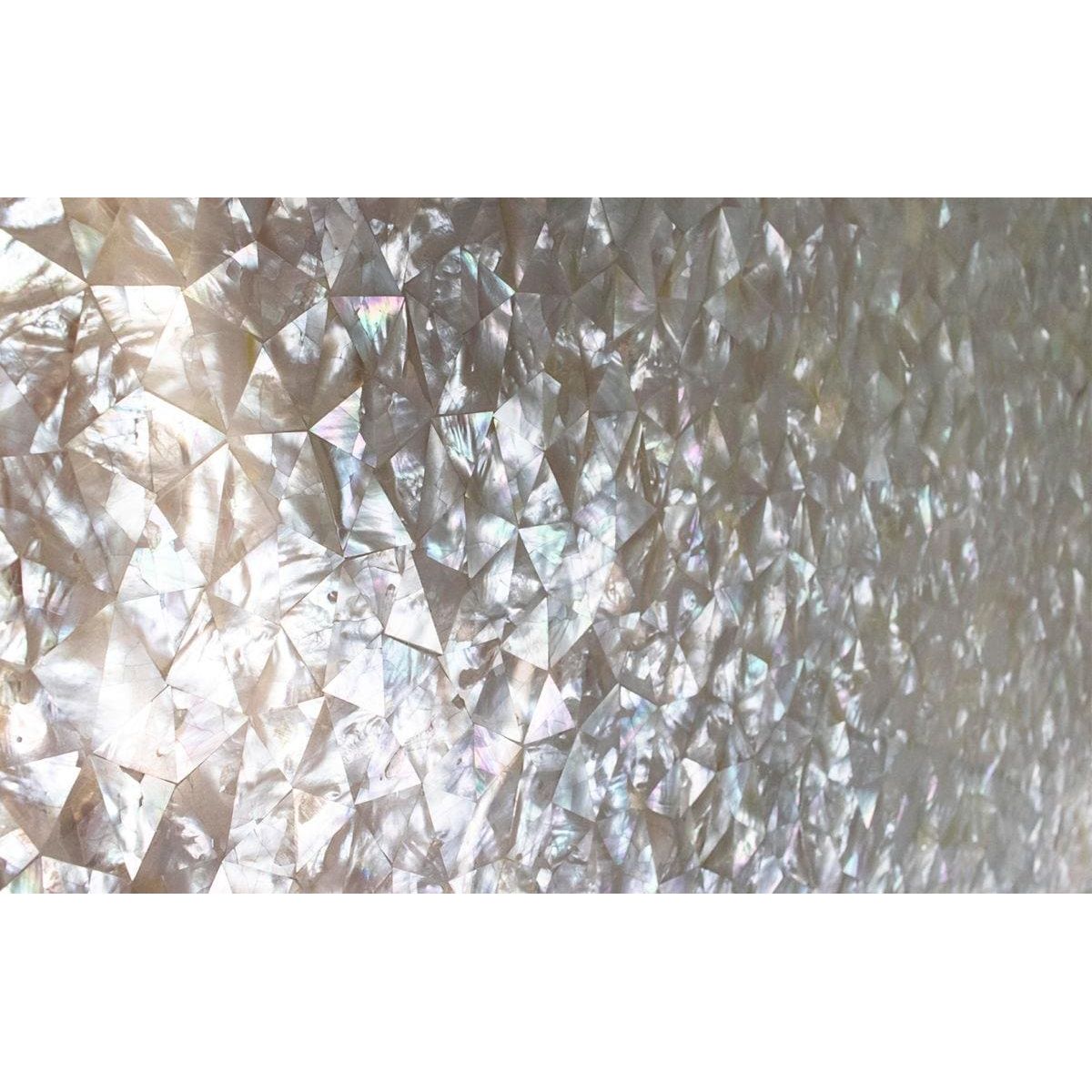 Iridescent mother-of-pearl triangular inlay with a shimmering pearlescent finish in feature panel crackle design