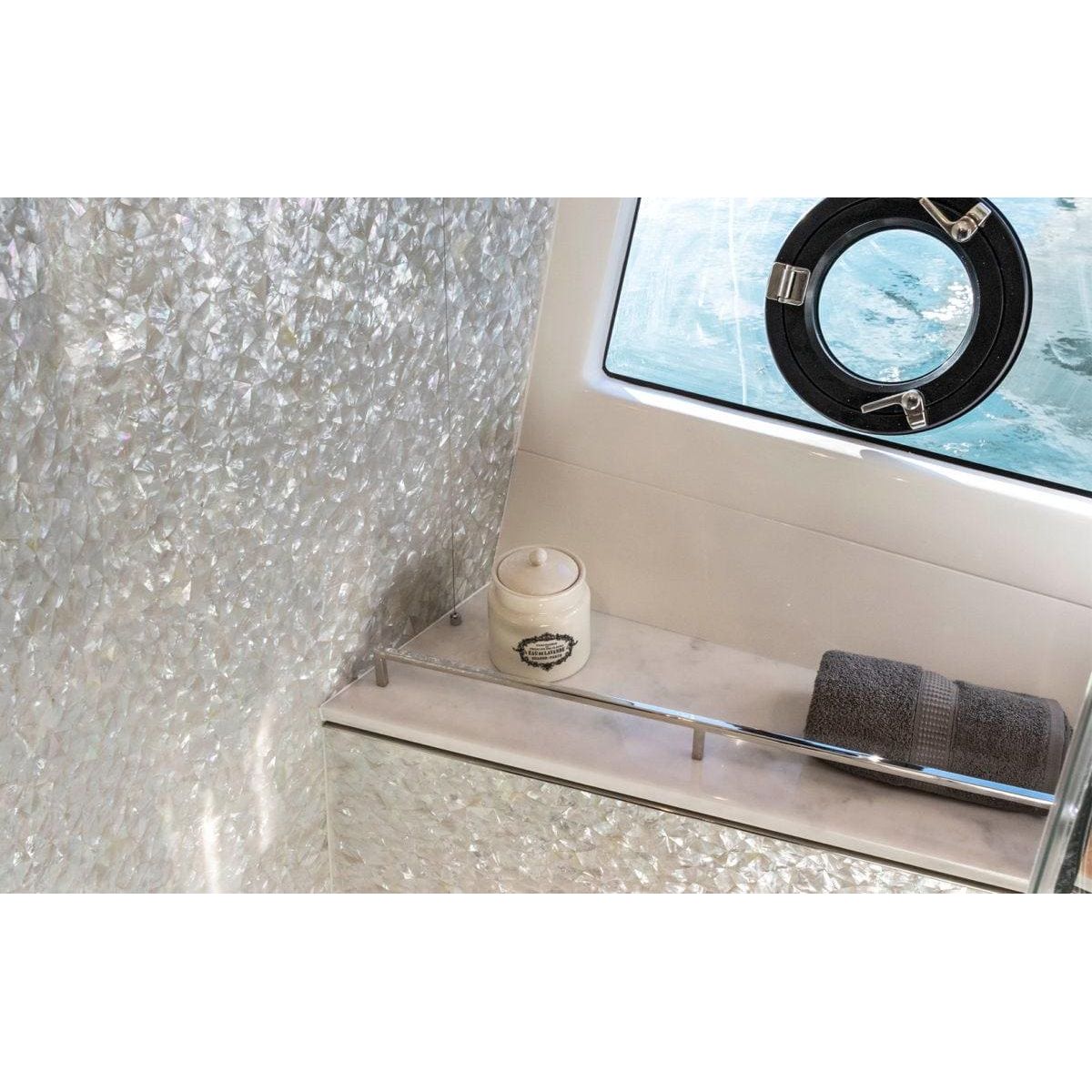 Feature Panel Crackle crackle-glass mosaic panel with a cream ceramic jar on a chrome shelf