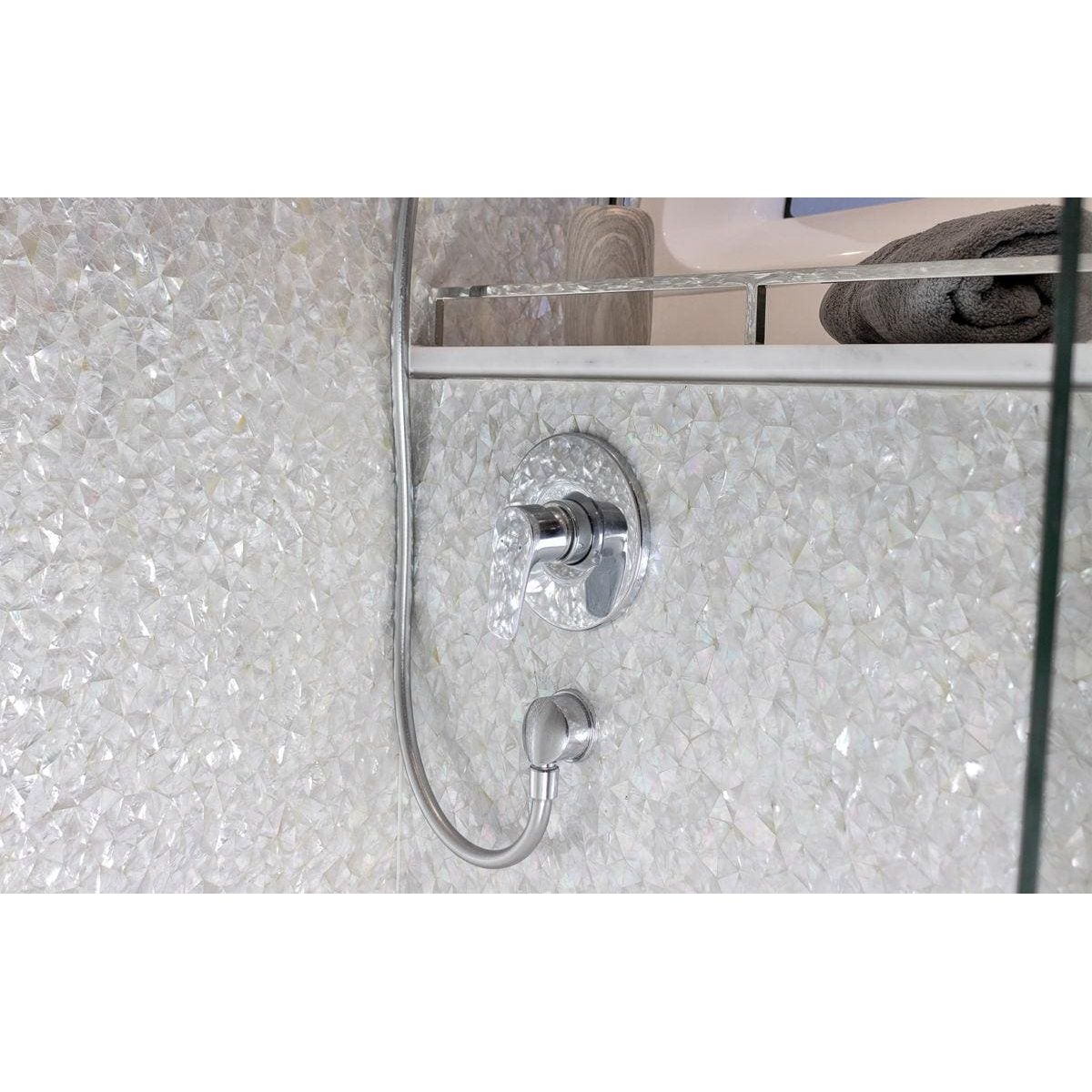 Feature Panel Crackle crackle-glass mosaic panel with a chrome shower tap and crystal handle