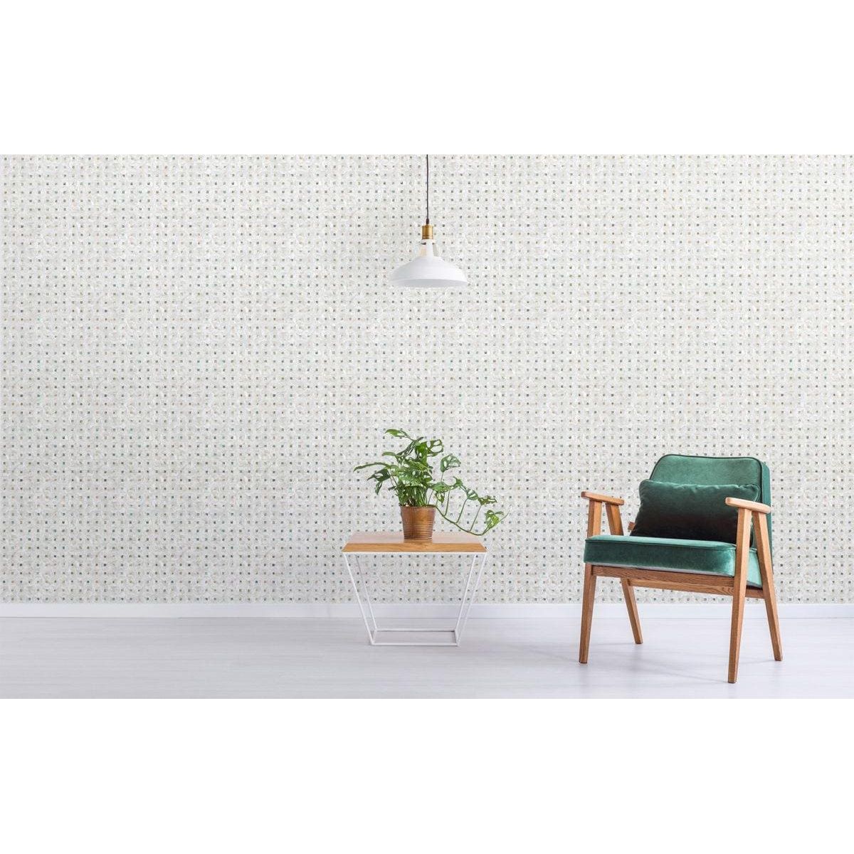 Feature Panel Gemstone iridescent abalone-shell mosaic panel with an emerald green velvet armchair