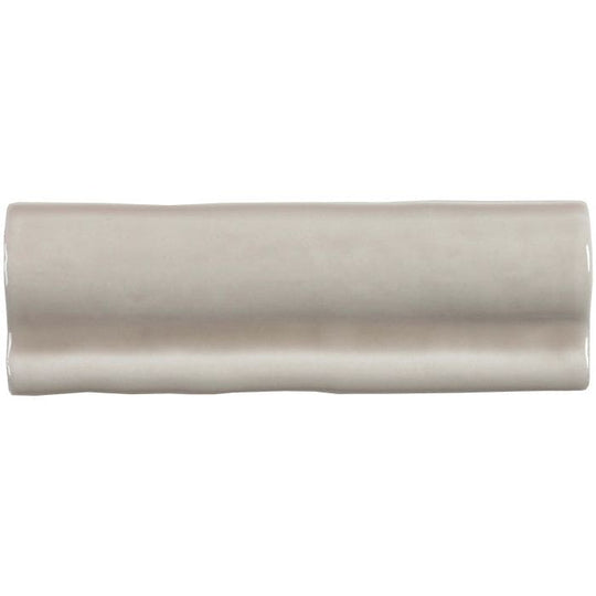 Beige ceramic flint torus moulding tile with smooth glossy finish and subtle wavy edges for decorative edging