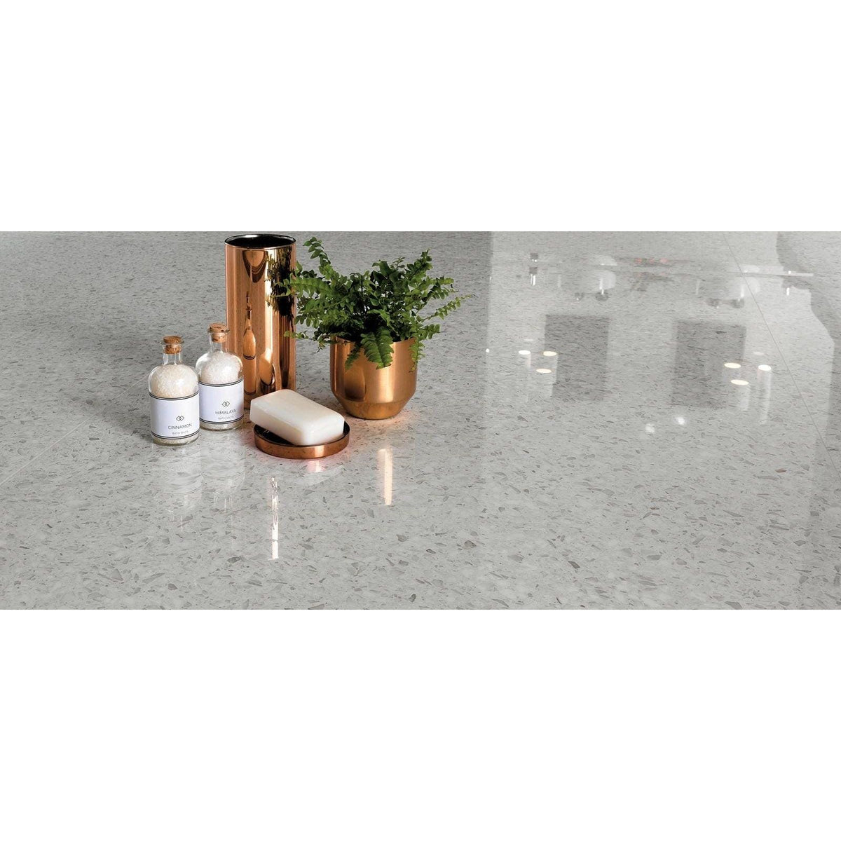 Gemstones Terrazzo White Matt 60 x 60cm white terrazzo tiles with a rose gold soap dispenser