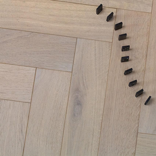 Goodrich Feather Oak light oak herringbone wood flooring with black dominoes
