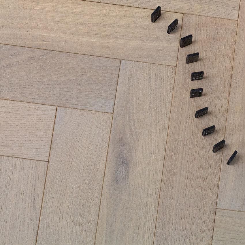 Goodrich Feather Oak light oak herringbone wood flooring with black dominoes