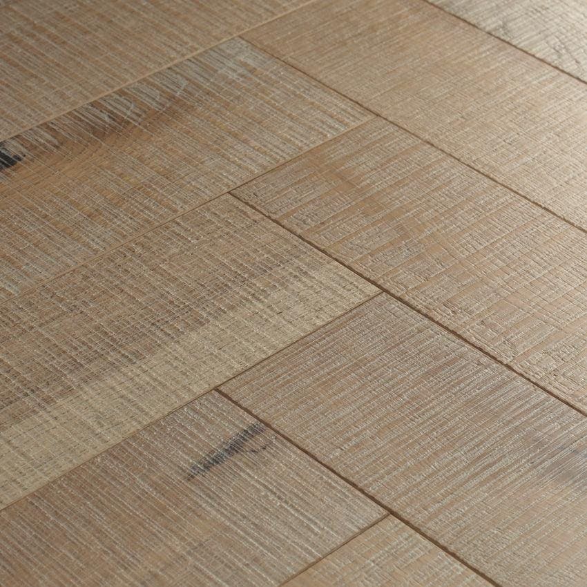 Goodrich salted oak light brown hardwood floor planks arranged in a herringbone pattern for elegant flooring