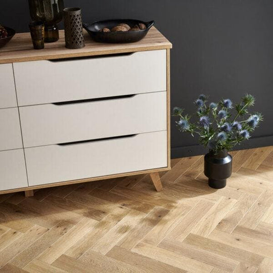 Modern white dresser with light smoked oak wood frame and tapered legs in Goodrich style