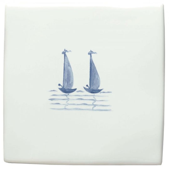 White ceramic coaster with delicate blue hand-painted sailboats from Grace & Ann of Liverpool Delft Boats collection