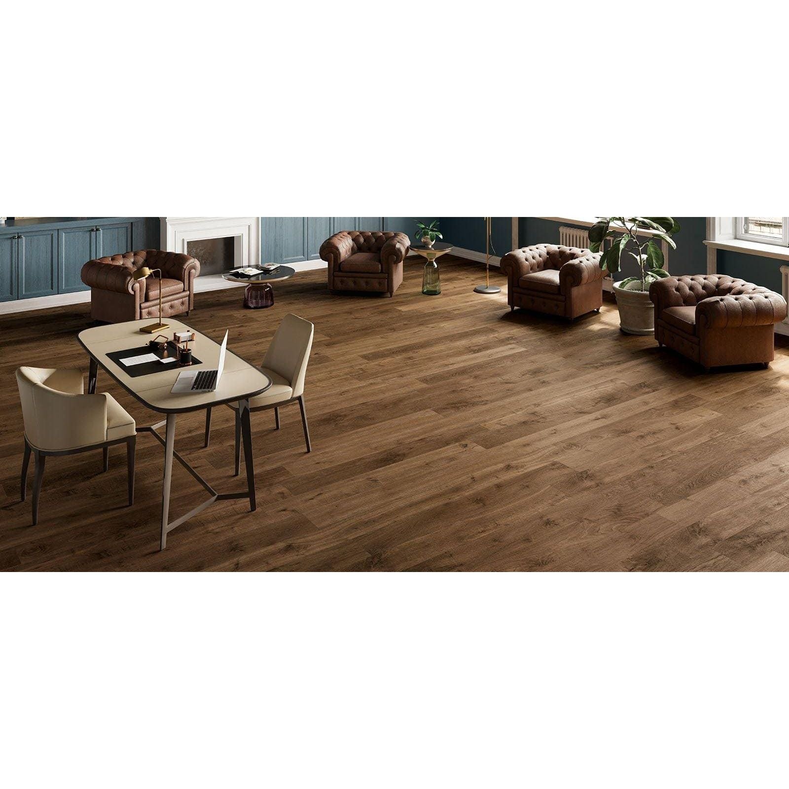 Brown leather tufted armchairs with classic button detailing paired with heartwood moka matt 20 x 120cm tiles