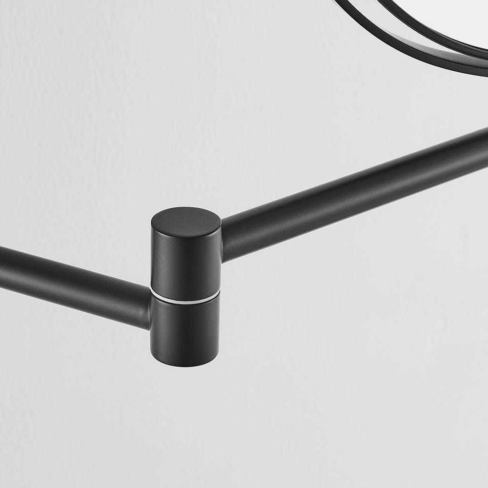 Black matte-finished metal towel rack with sleek minimalist design shown alongside hutton reversible 5x magnifying wall mirror black