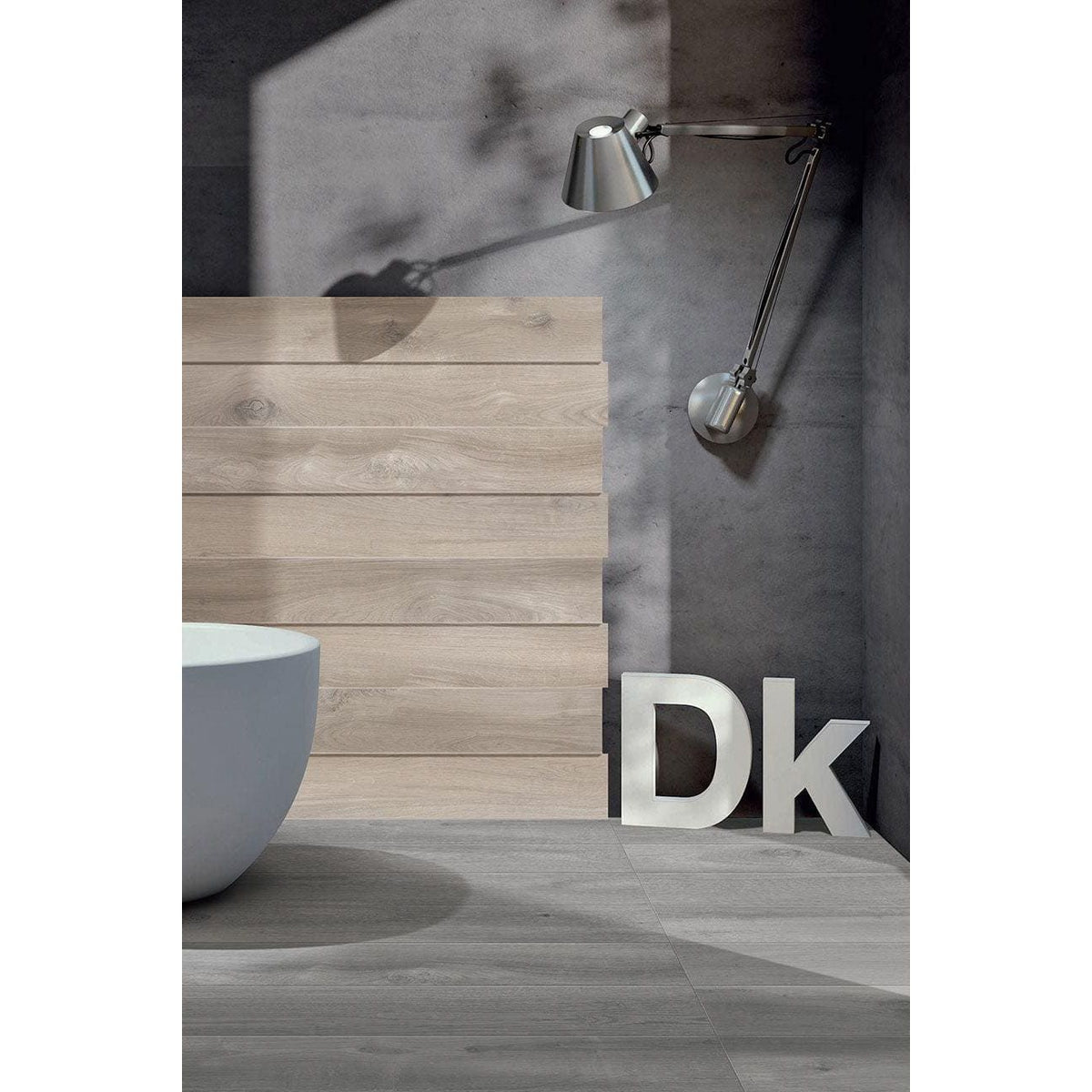 Kingfisher Grey grey wood-effect floor tiles with a silver wall-mounted lamp