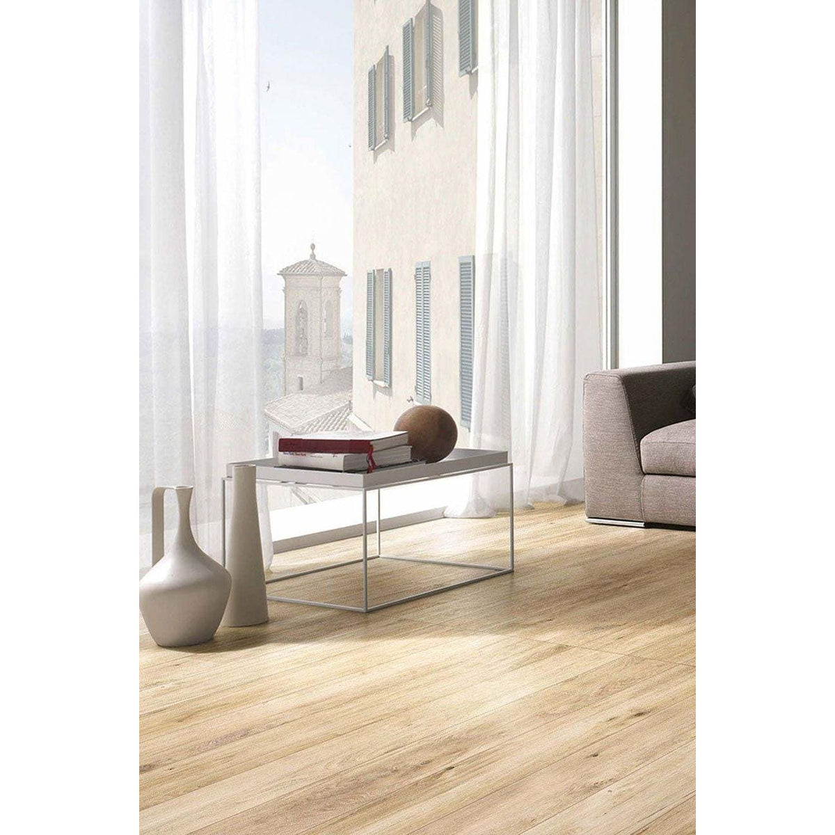 Kingfisher Oak light oak wood-effect floor tiles with a black metal coffee table