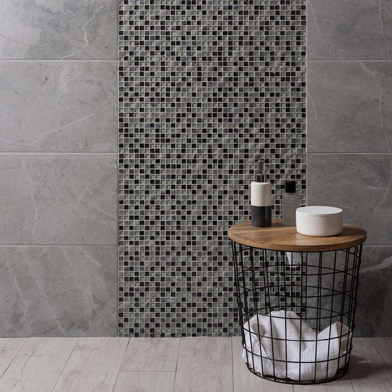 Black and gray mosaic tile accent wall from lial earth and fire mixed mosaics featuring stone and glass materials