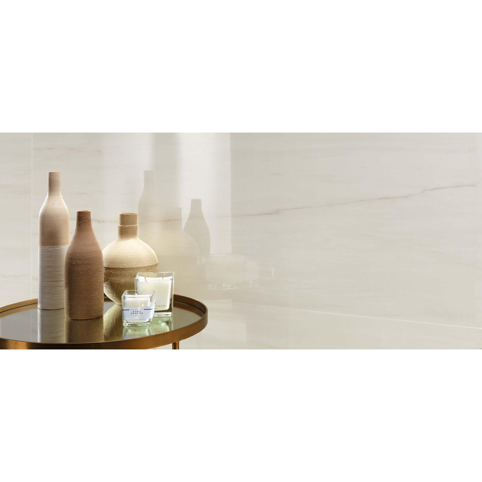 Beige ceramic vases with textured surfaces and wooden lids displayed on a glass table featuring Marvel Bianco Dolomite Matt 30x60cm tiles