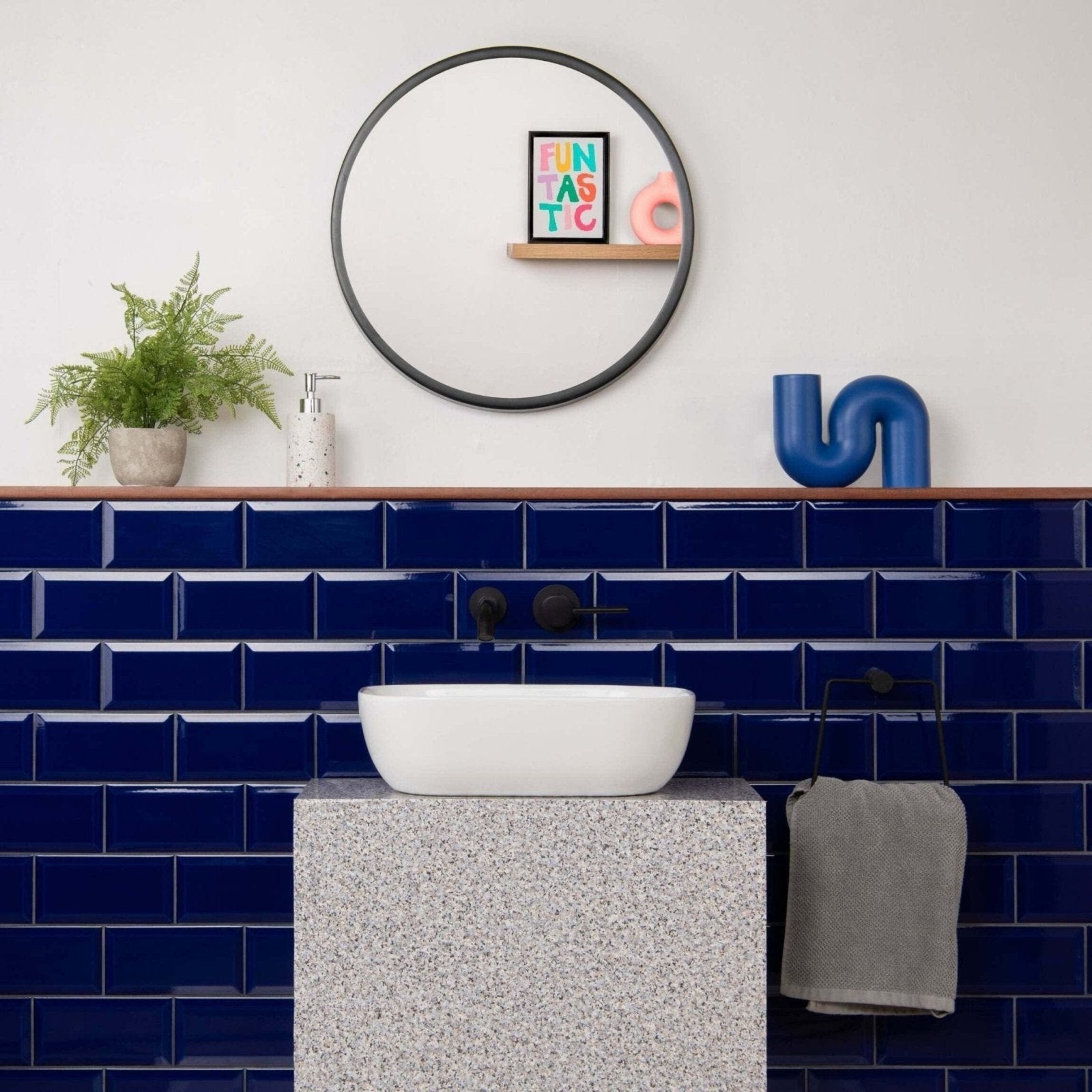 White ceramic vessel sink metro cobalto gloss with sleek modern design on speckled gray stone countertop