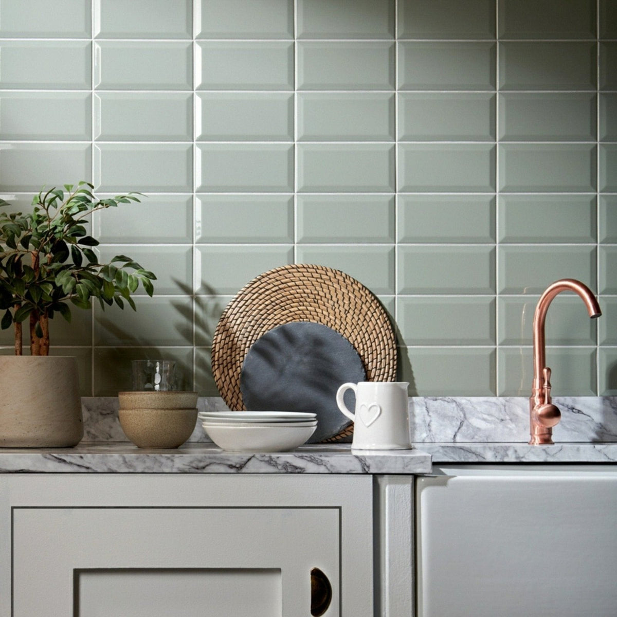A white ceramic pitcher with a heart-shaped handle and subtle glossy finish from Metro Sage Gloss collection