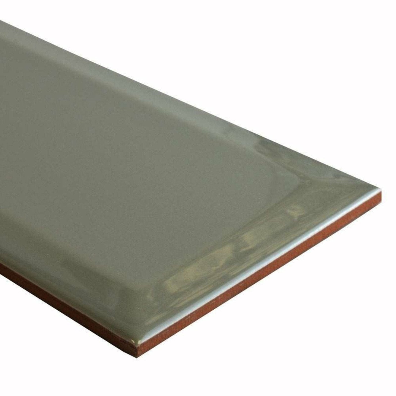 A sleek matte-finished rectangular Metro Sage Gloss tile with grayish-green glaze and visible terracotta edges