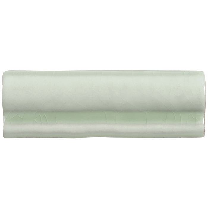 A smooth pale green ceramic mint torus moulding tile with subtle glossy finish and faint engraved lower edge patterns