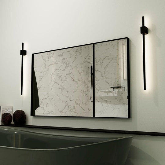 Modern black-framed Newington rectangular mirror with white marble-patterned glass panels and sleek vertical wall sconces