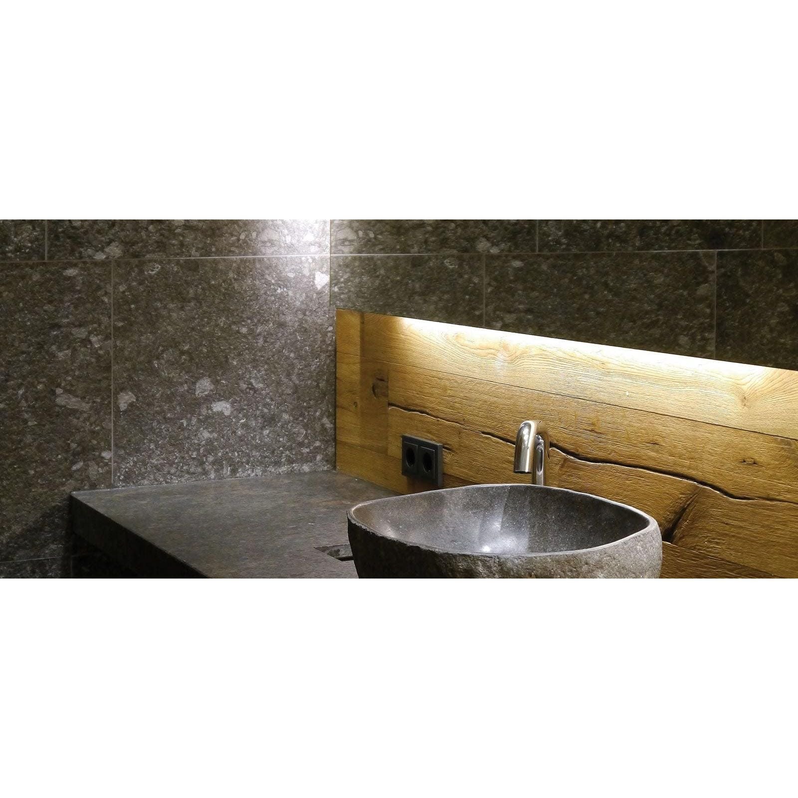 Norway Svart Matt dark grey terrazzo-effect tiles with a stone sink