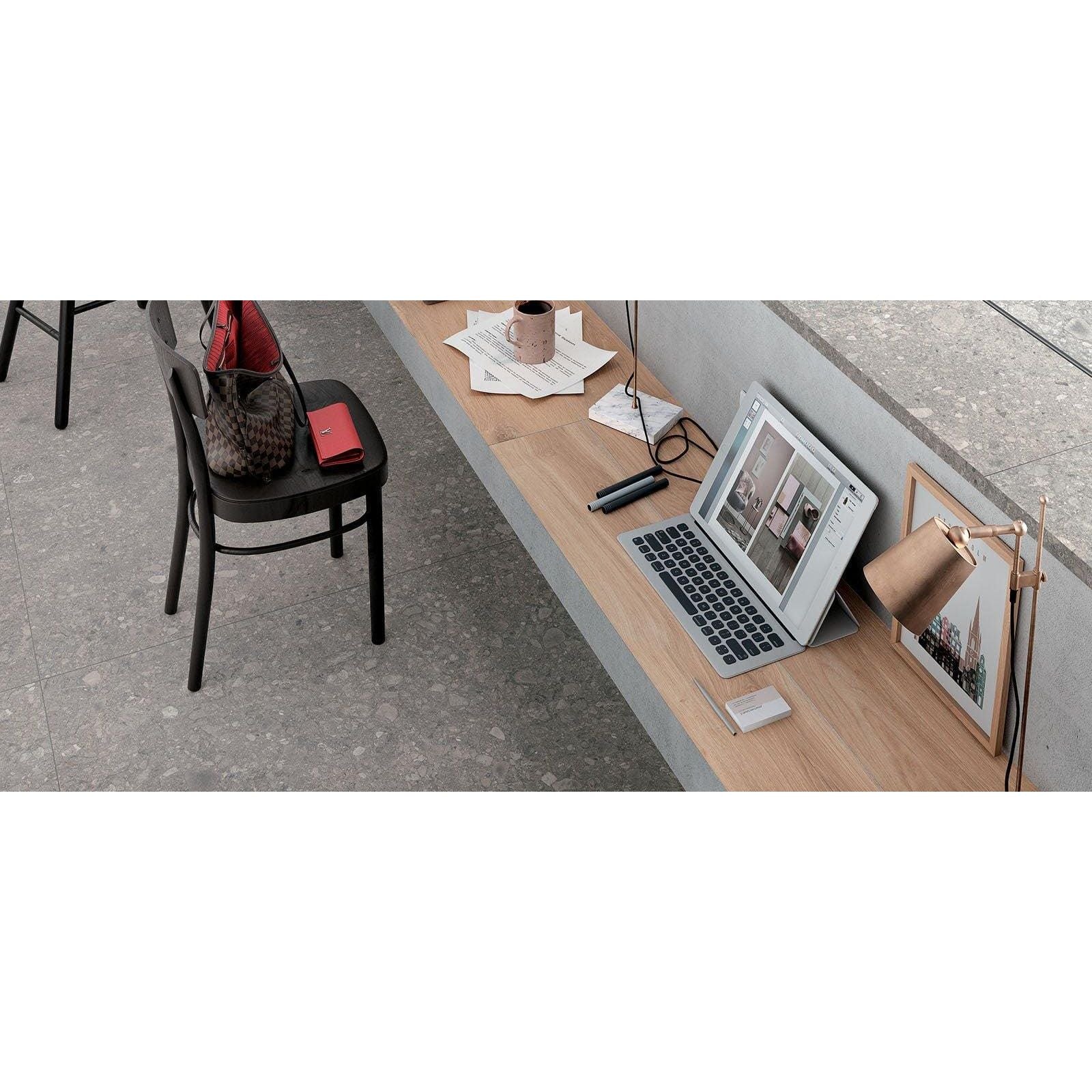 Norway Vit Matt light grey terrazzo-effect tiles displayed on a laptop screen