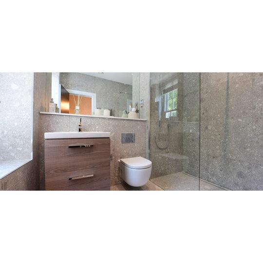 Norway Vit Matt light grey terrazzo-effect tiles with a wood-grain vanity